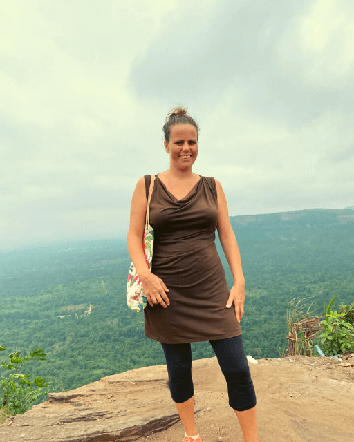 Patricia, co-founder of Experience Africa, on top of a mountain in her living area in Ghana